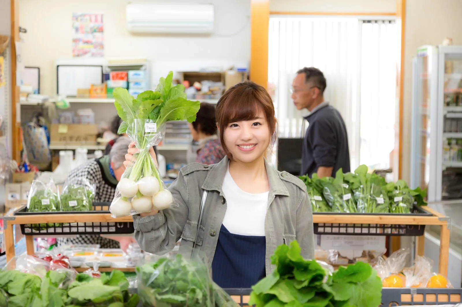 Fresh vegetables in baskets at a rural Japanese farm-direct produce shop